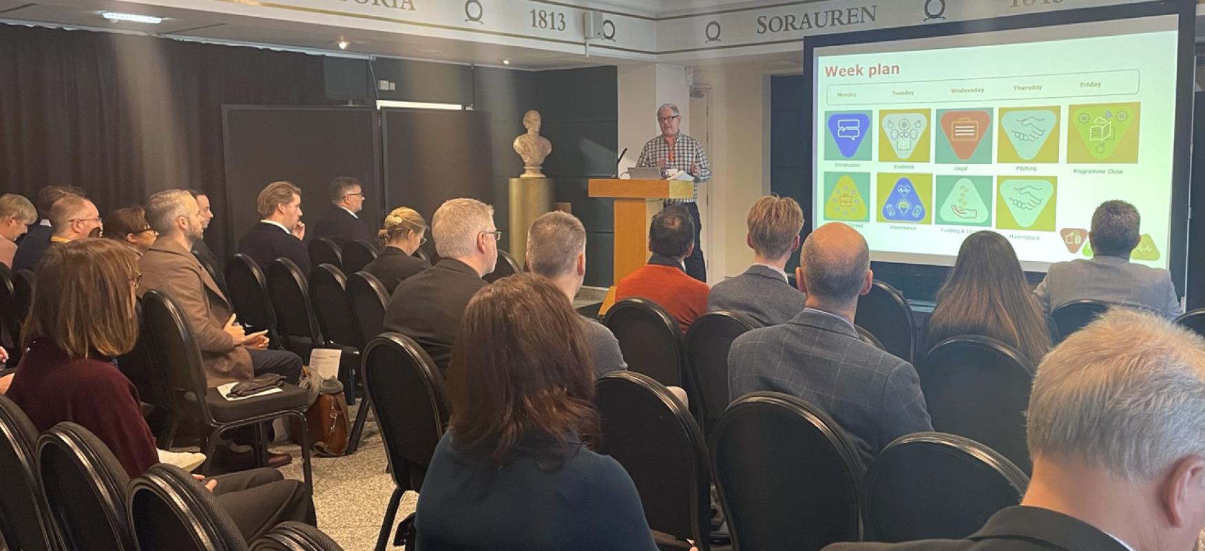 Nordic Propel Bootcamp lecture. People following a lecture and watching a PP on a screen.