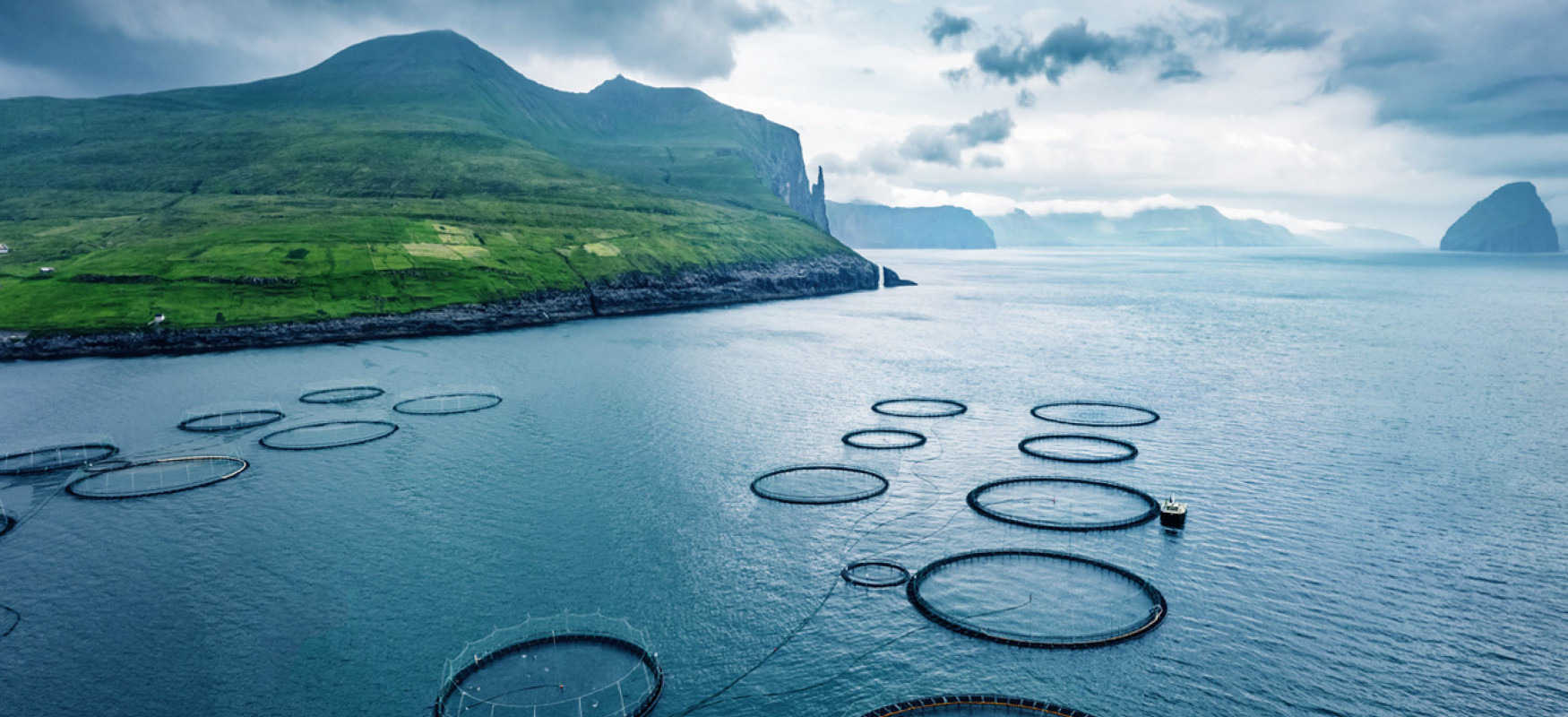View of a fjord with fish farms in the Faroe Islands
