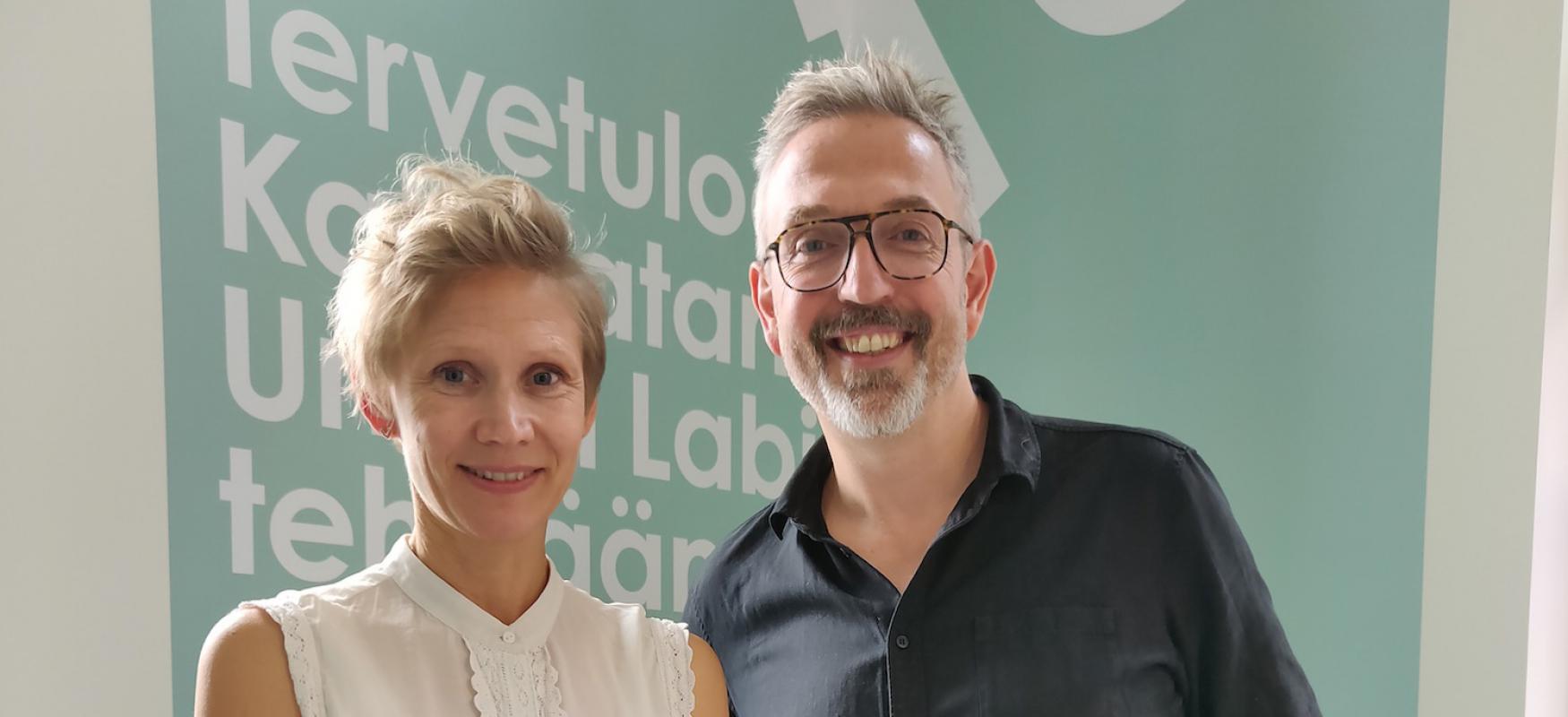 A woman and a man standing next to each other