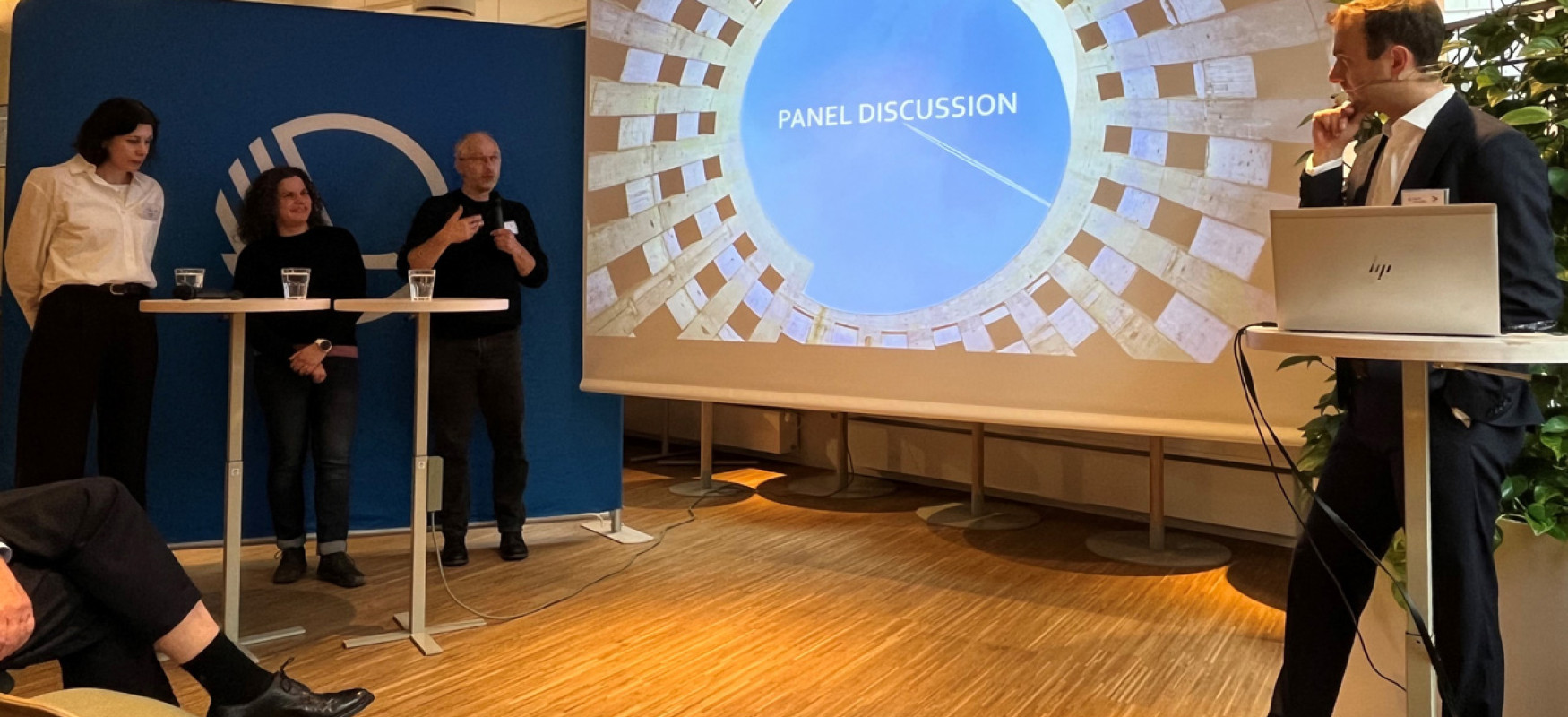 Panel discussion with three participants and a moderator