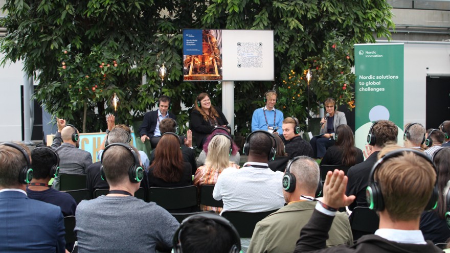 Panel debat at TechBBQ 2025. Panelists on stage and audience i front